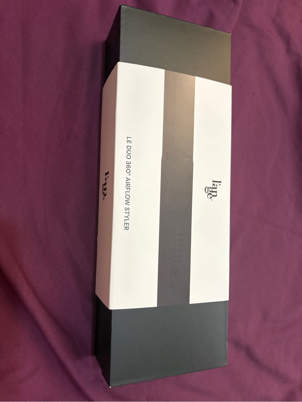 L'ange Matte Black Styling Tool on Deep Purple Surface